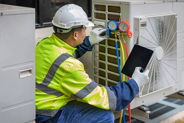 Professional Heat Pump Repair technician working in Garfield, TX